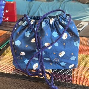 Japanese style bento box with accessories and bag. Used in good condition.
